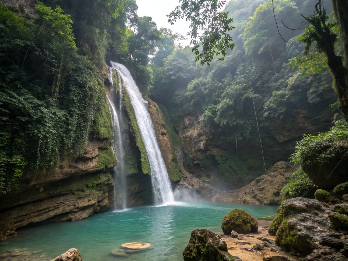 Majestic waterfall cascading into a turquoise natural pool surrounded by lush Dominican Republic jungle